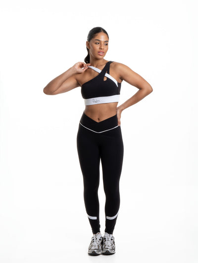 FRDM Wellness Flow Set for women, matching top and bottoms, breathable performance set shown in motion.